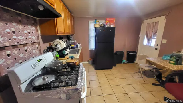 a room with furniture a rug and a lamp