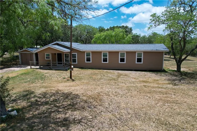 a house with trees in the background