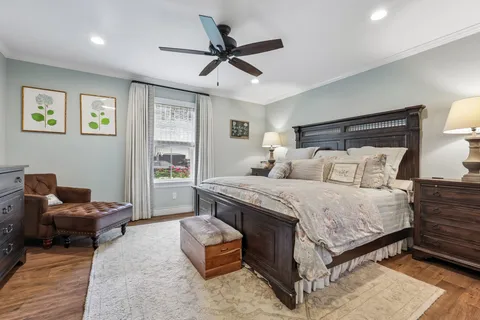 a bedroom with a bed and a couch