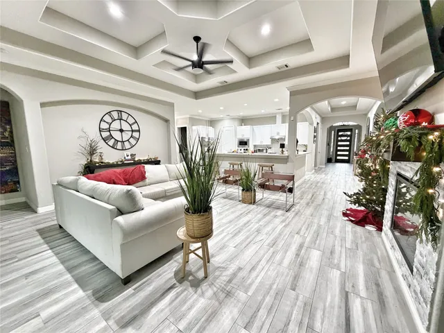 a living room with furniture and a potted plant