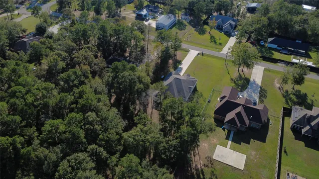 an aerial view of houses with yard