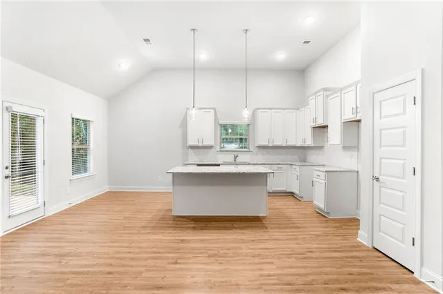 a bathroom with a granite countertop sink and a granite counter tops