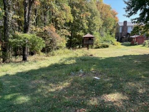 1924 Sohn Road Aliquippa, PA 15001 - Photo 8 of 46 a view of a yard with plants and bench