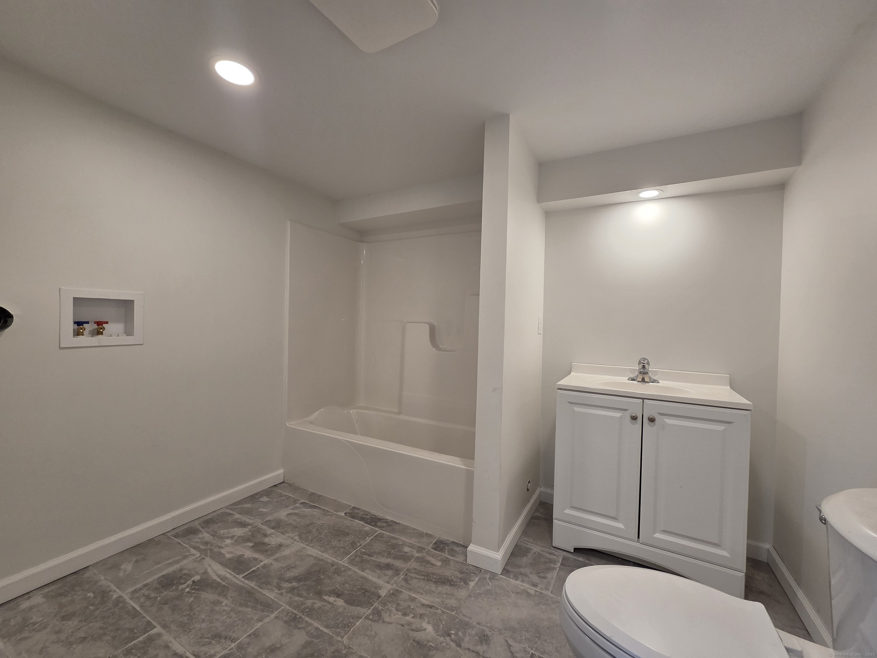 395 Bailey Hill Road Killingly, CT 06239 - Photo 30 of 36 a bathroom with a toilet a sink and shower