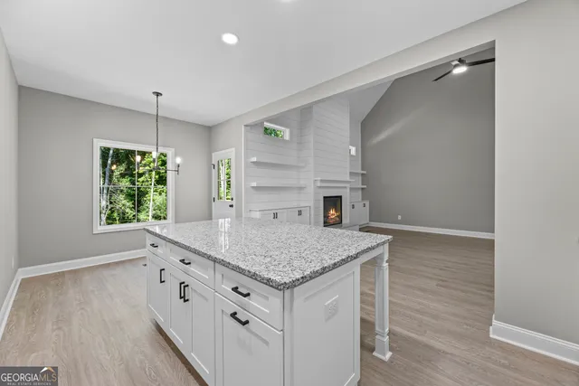a kitchen with a sink stove and refrigerator