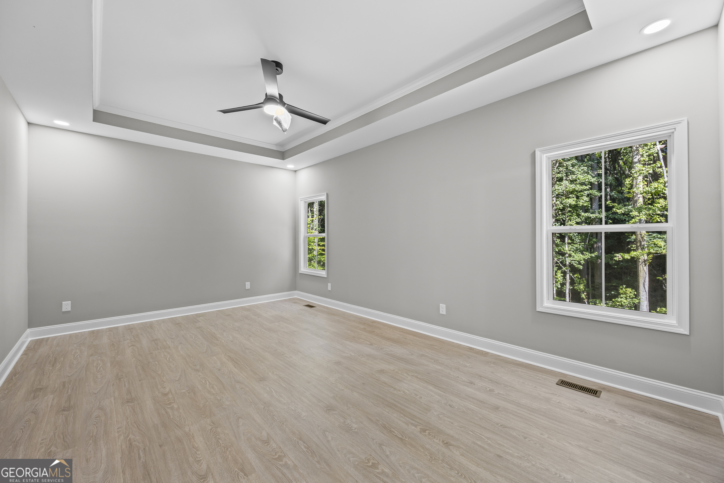 119 Gordon Road Commerce, GA 30530 - Photo 15 of 40 a view of an empty room with wooden floor and windows