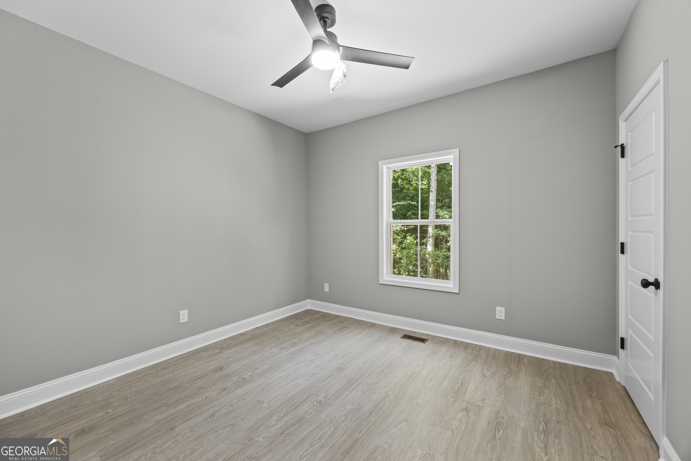 119 Gordon Road Commerce, GA 30530 - Photo 21 of 40 wooden floor in an empty room with a window