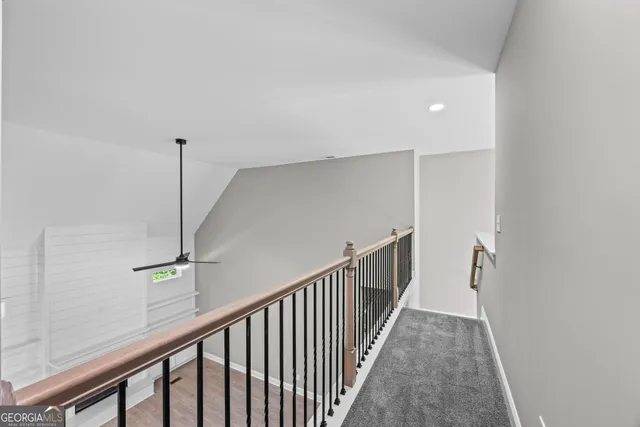 a view of a hallway with staircase