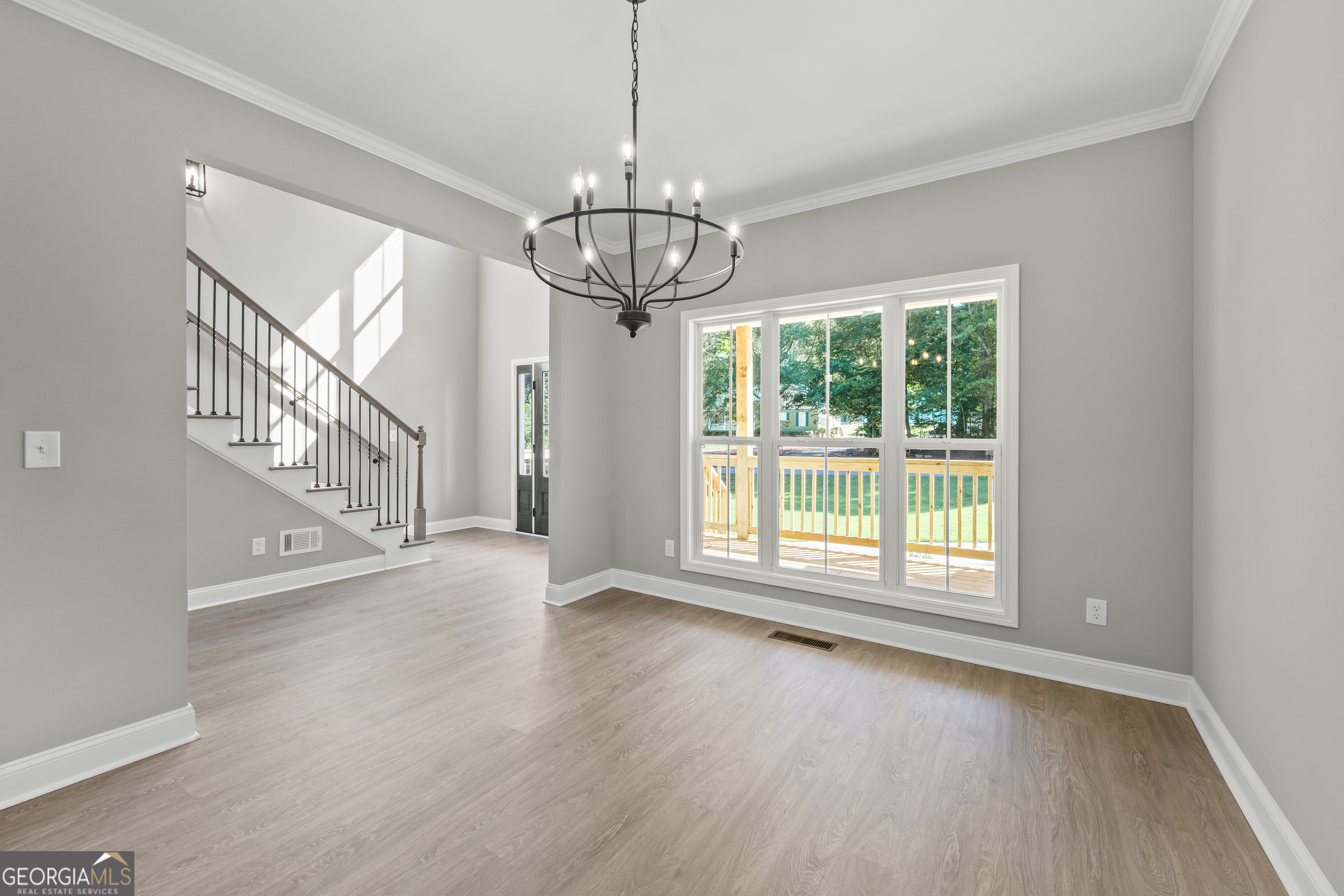 119 Gordon Road Commerce, GA 30530 - Photo 5 of 40 a view of empty room with wooden floor and fan