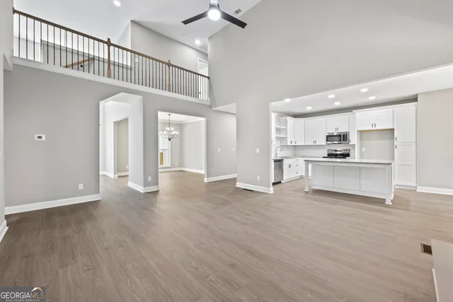 a view of kitchen with wooden floor and a kitchen