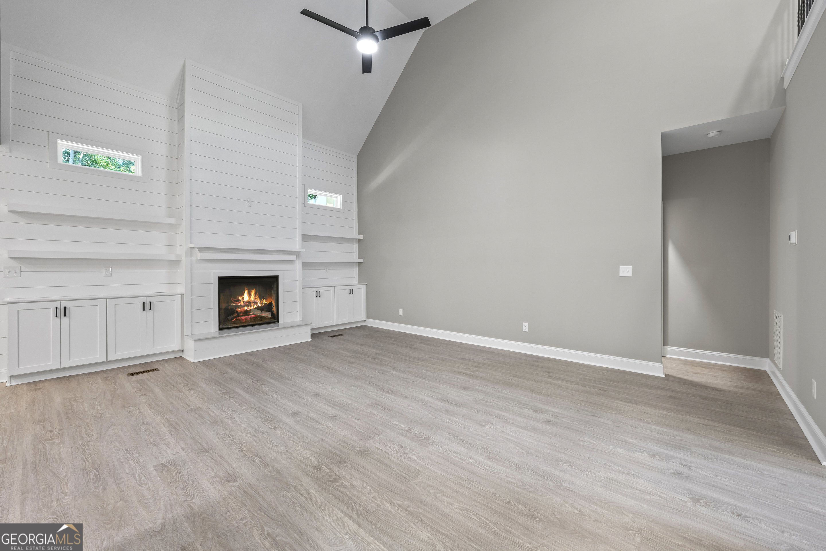 119 Gordon Road Commerce, GA 30530 - Photo 9 of 40 a view of an empty room with a fireplace and a window
