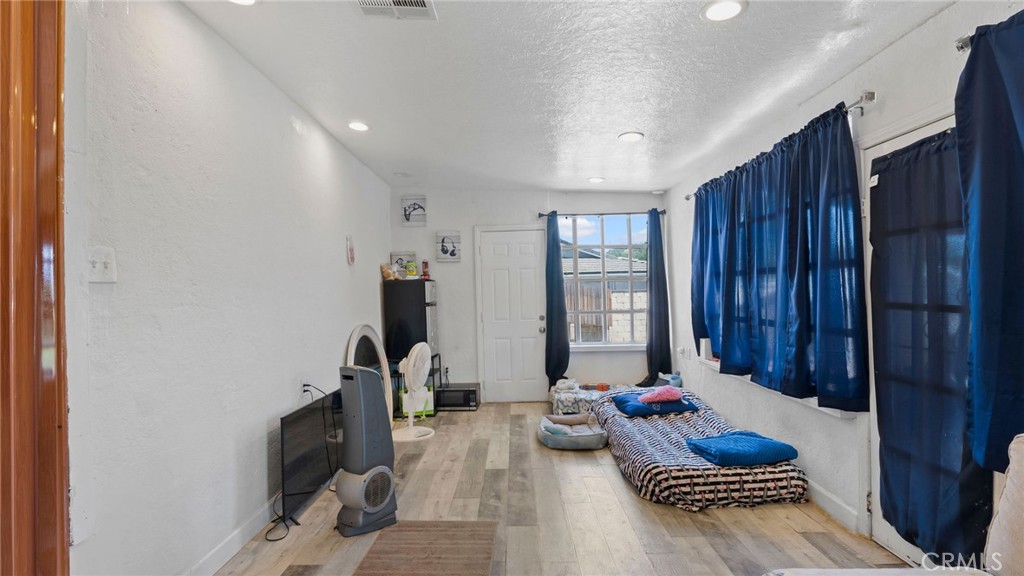 8035 Santa Rita Street Corona, CA 92881 - Photo 11 of 37 a living room with furniture and musical instruments