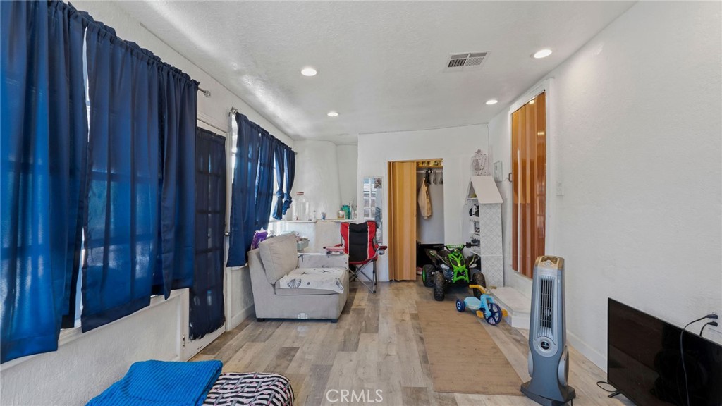 8035 Santa Rita Street Corona, CA 92881 - Photo 12 of 37 a living room with furniture and a fireplace