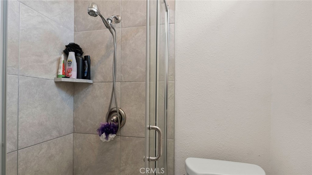8035 Santa Rita Street Corona, CA 92881 - Photo 18 of 37 a bathroom with a toilet