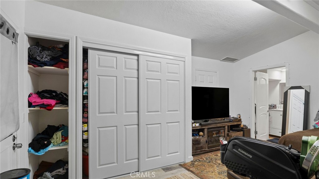 8035 Santa Rita Street Corona, CA 92881 - Photo 23 of 37 a living room with furniture and a flat screen tv