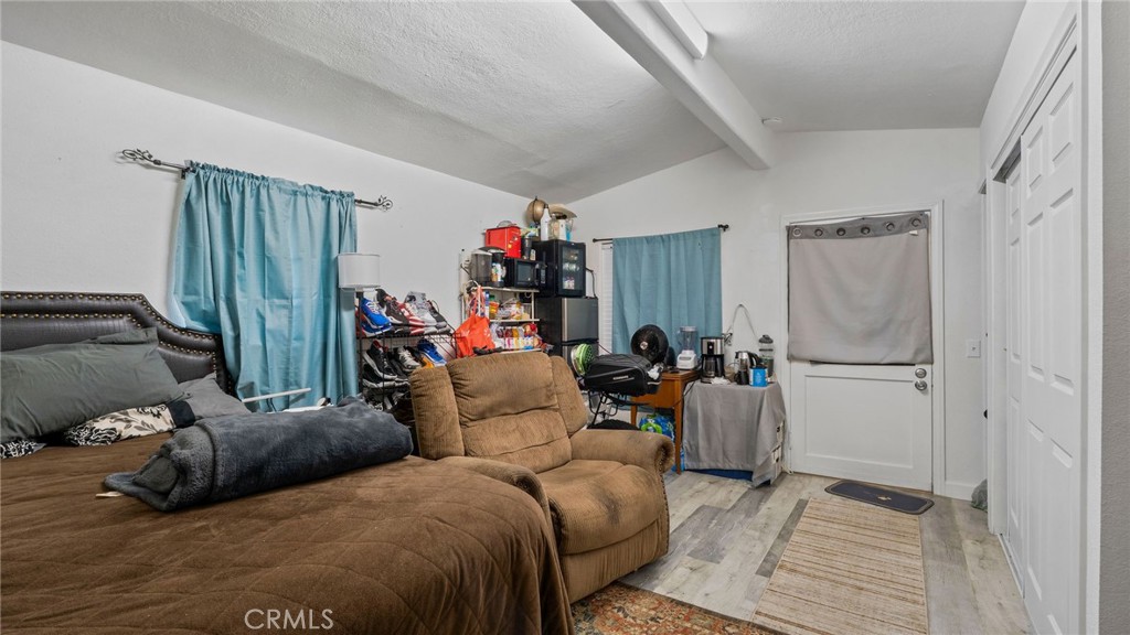 8035 Santa Rita Street Corona, CA 92881 - Photo 24 of 37 a bed room with a bed and a couch