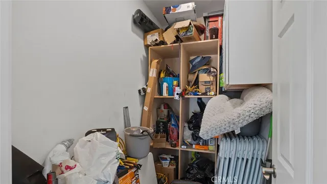 a room with furniture a rug and a window