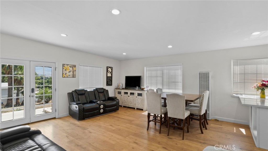 8035 Santa Rita Street Corona, CA 92881 - Photo 5 of 37 a living room with furniture a flat screen tv and a fireplace