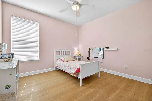 a view of room with cabinet and ceiling fan