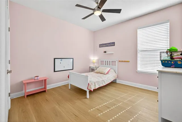 a bathroom with a granite countertop sink toilet and mirror