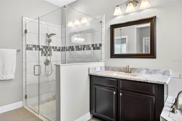 a living room with furniture and a lamp