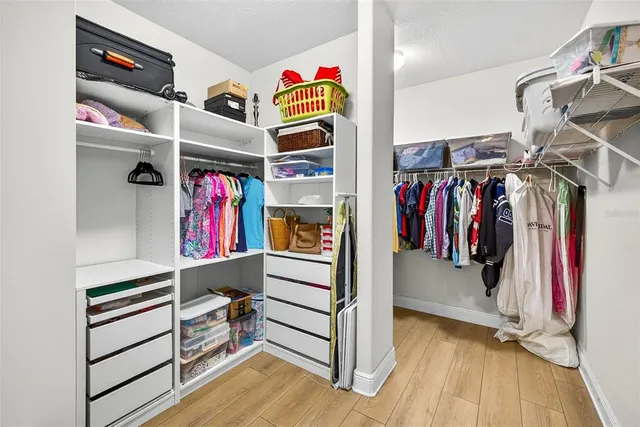 a view of a livingroom with furniture and a ceiling fan