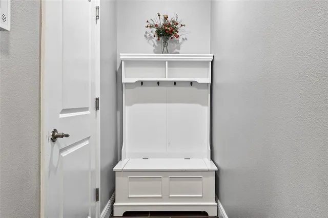 a view of a patio with a table chairs and a backyard