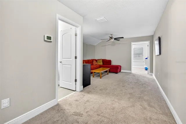 a large house with a big yard and large trees