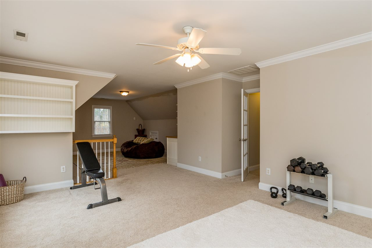 3705 Wesley Ridge Drive Apex, NC 27539 - Photo 22 of 30 Bonus room with back stairs to Kitchen, and hallway to bedrooms and laundry area. Bonus Room