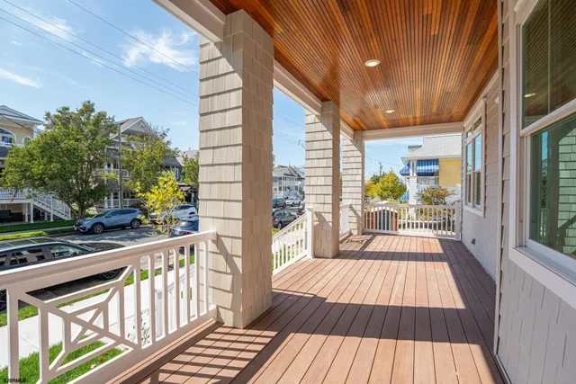 a view of balcony with wooden floor