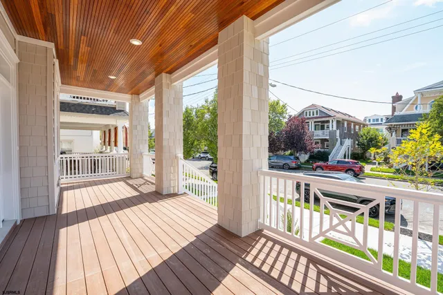 a view of a balcony with wooden floor