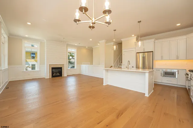a view of kitchen with cabinets and wooden floor