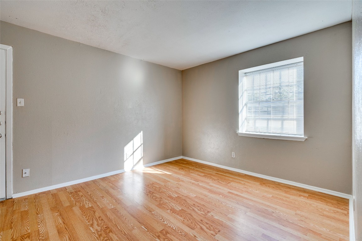 307 East 31st Street, Unit 205 Austin, TX 78705 - Photo 8 of 35 a view of empty room with wooden floor and fan