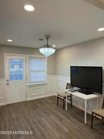 a view of a livingroom with furniture and wooden floor