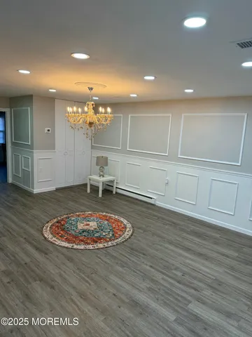 a close view of a sink and dishwasher with kitchen island