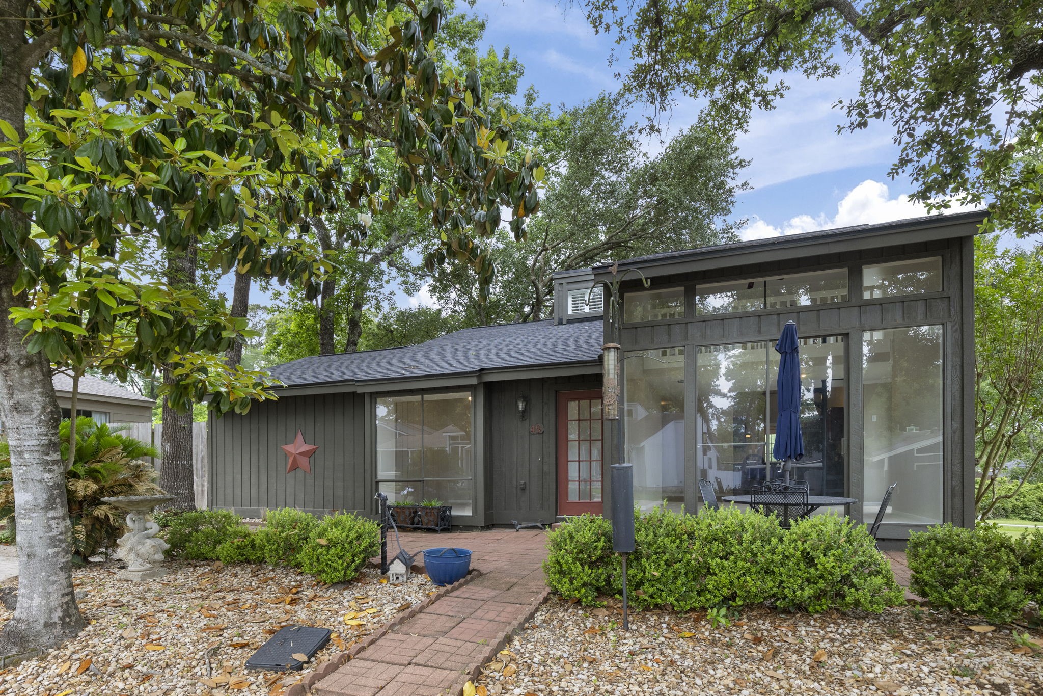 49 April Village Conroe, TX 77356 - Photo 4 of 46 a front view of a house with garden