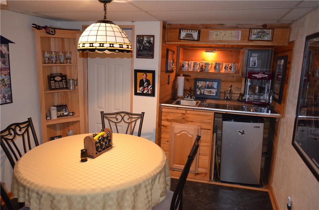 474 Haverhill Road Mt. Lebanon, PA 15228 - Photo 14 of 20 Finished Game room - kitchenette Area - note the Steeler light does not stay and we will replace with a standard light. Wet Bar