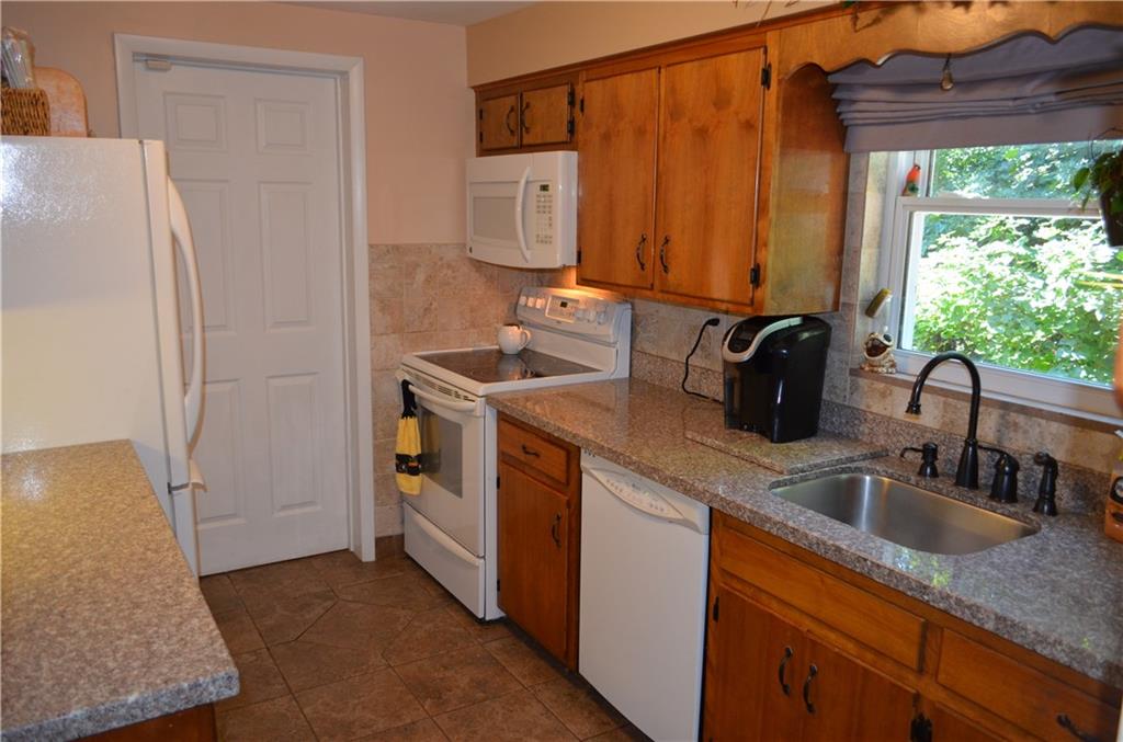 474 Haverhill Road Mt. Lebanon, PA 15228 - Photo 4 of 20 Kitchen, Updated granite counter tops, Ceramic tile floors, Ceramic back splash, all newer updated interior doors, updated sink fixtures and door handle hardware