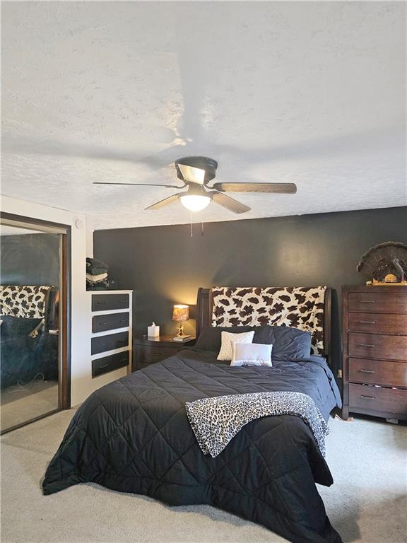 3413 4th Street Dunbar, PA 15431 - Photo 11 of 13 a bedroom with a bed and dresser with mirror