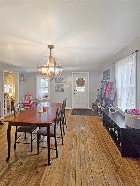 3413 4th Street Dunbar, PA 15431 - Photo 3 of 13 a view of a dining room with furniture and wooden floor