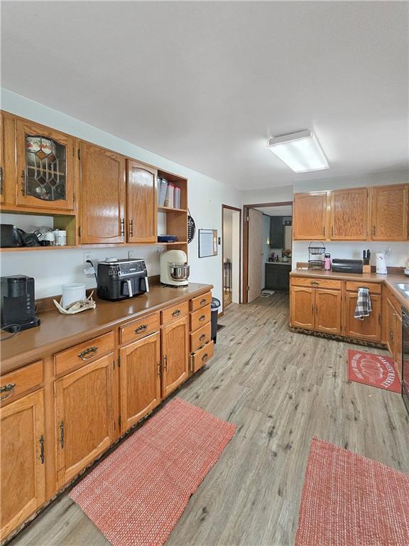 3413 4th Street Dunbar, PA 15431 - Photo 6 of 13 a kitchen with stainless steel appliances granite countertop a stove top oven a sink dishwasher and cabinets with wooden floor