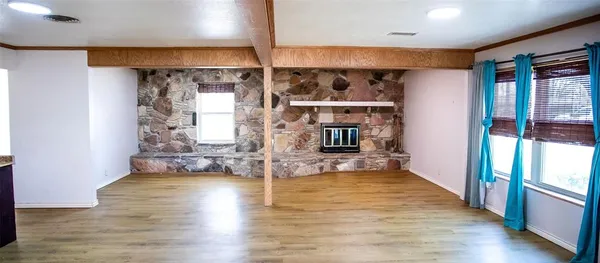 a view of open kitchen with wooden floor