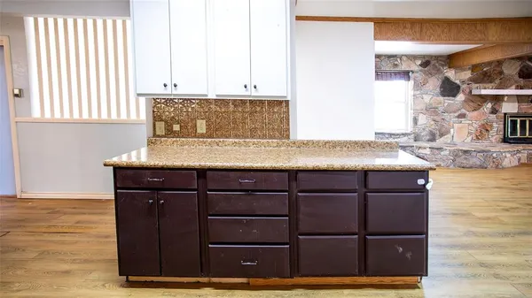 a view of hallway with wooden floor