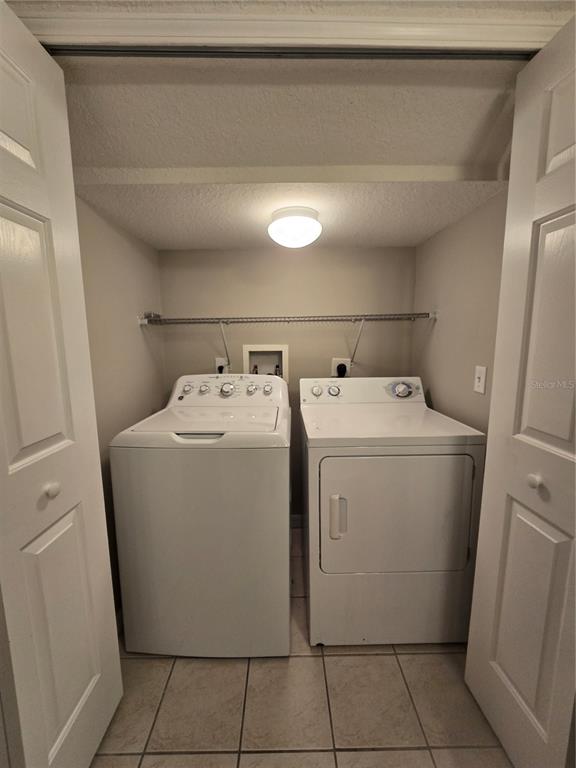 236 Castlekeeper Place Valrico, FL 33594 - Photo 5 of 14 a utility room with dryer and washer