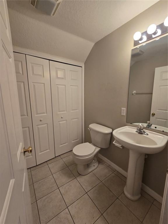 236 Castlekeeper Place Valrico, FL 33594 - Photo 6 of 14 a bathroom with a sink a toilet and mirror