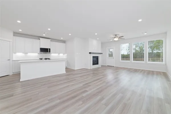a view of kitchen with cabinets and wooden floor