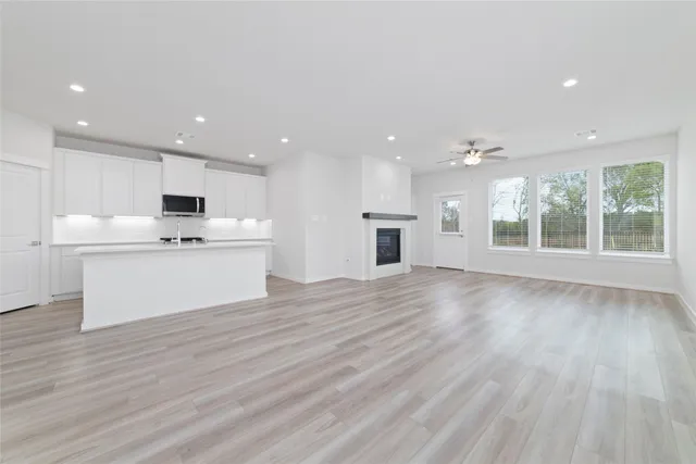 a view of kitchen with cabinets and wooden floor