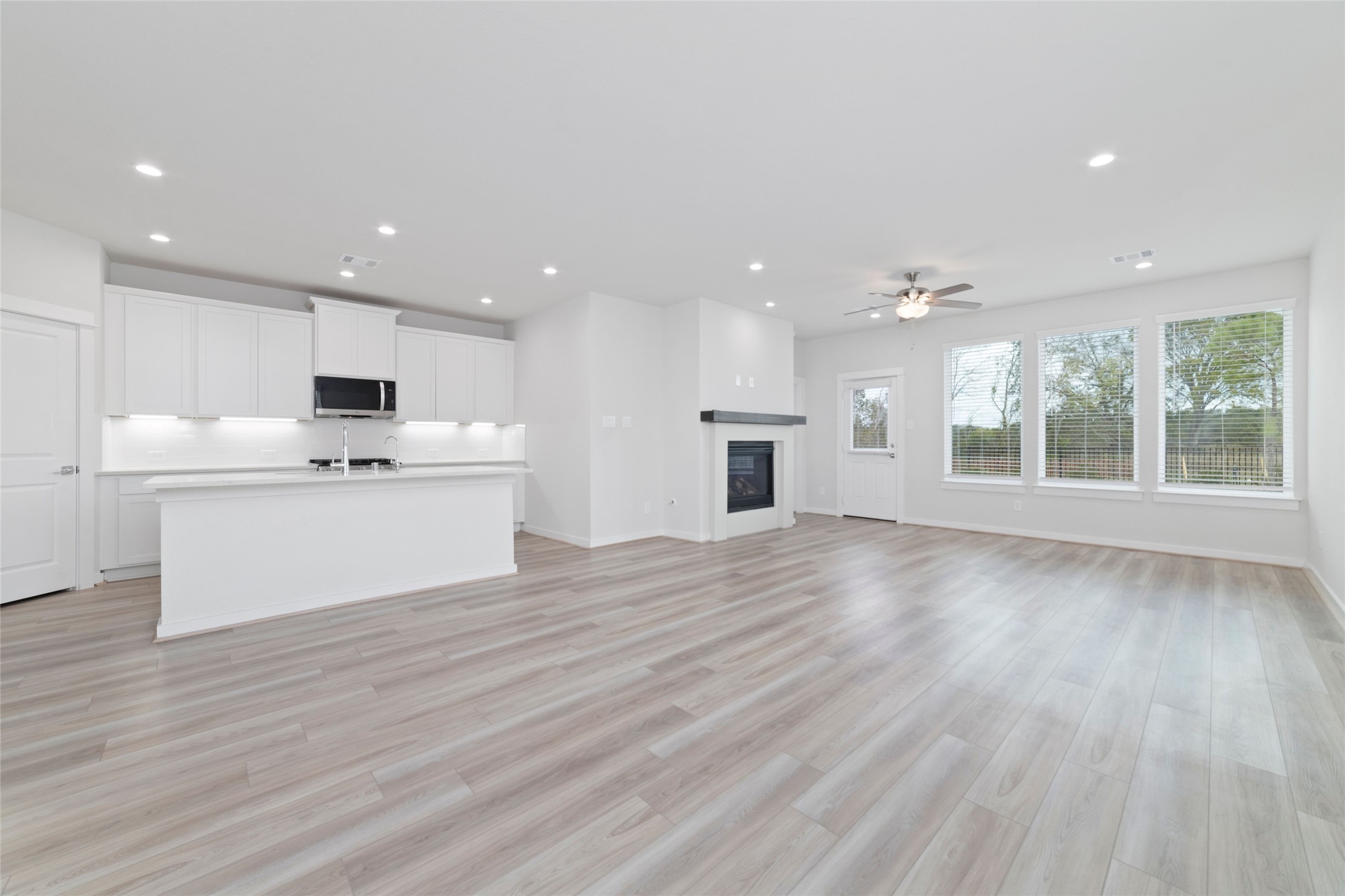 32906 School Hl Road Fulshear, TX 77441 - Photo 12 of 25 a view of kitchen with cabinets and wooden floor