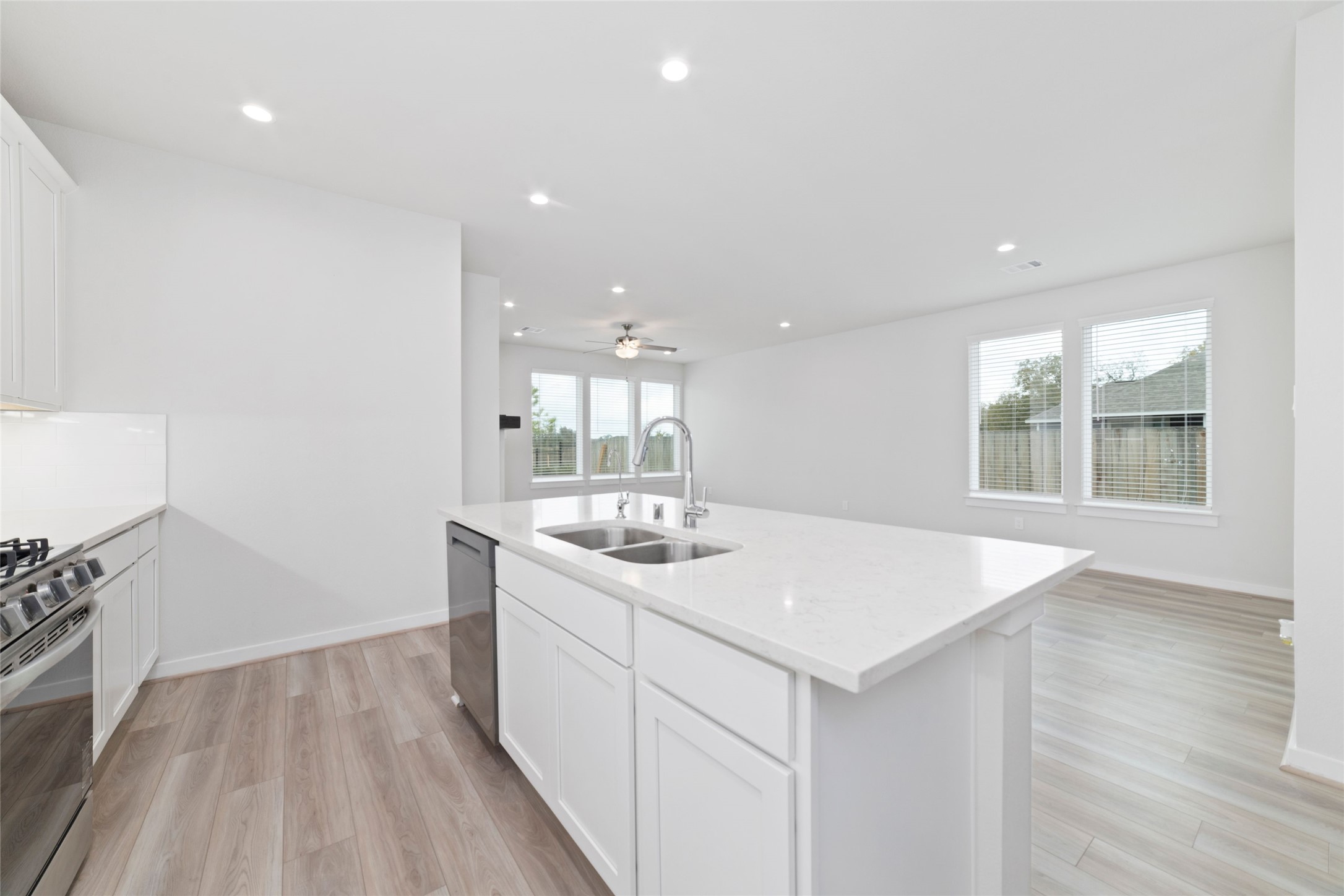 32906 School Hl Road Fulshear, TX 77441 - Photo 17 of 25 a kitchen with a sink and wooden floor