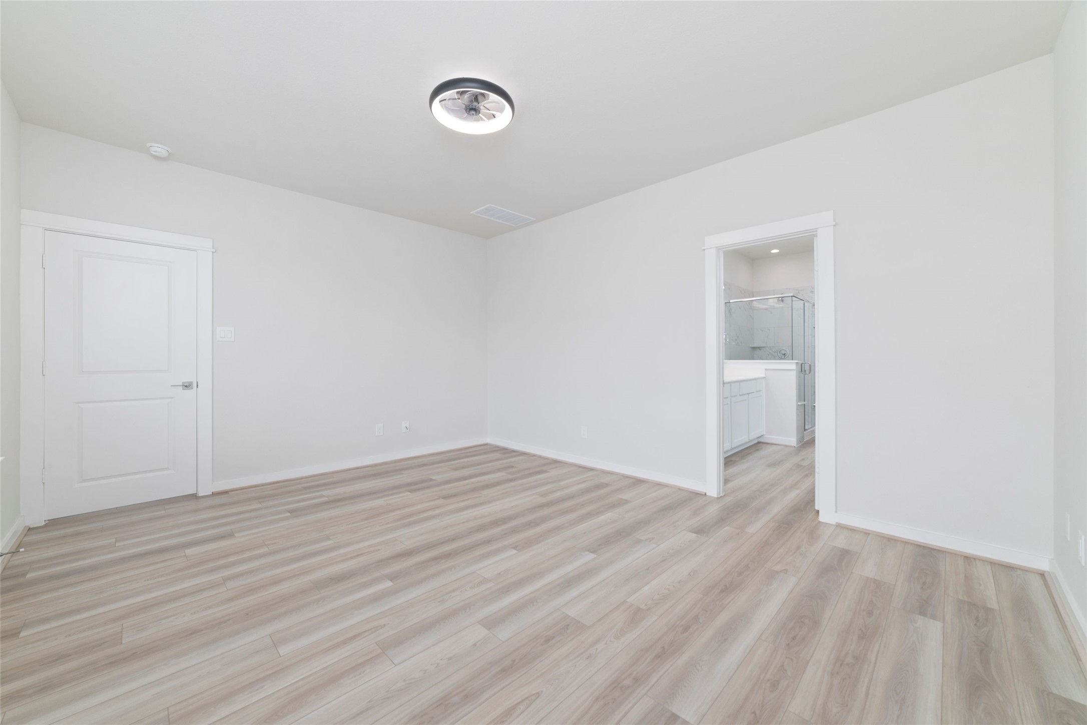 32906 School Hl Road Fulshear, TX 77441 - Photo 20 of 25 a view of an empty room with wooden floor